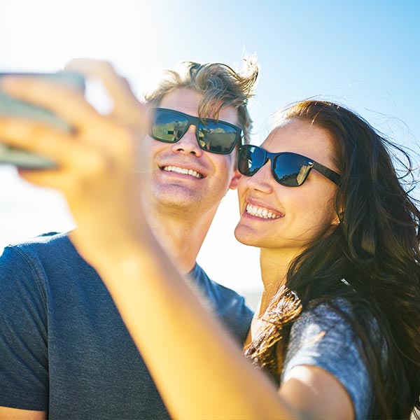 couple with beautiful smiles on beach