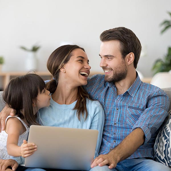 family on computer in home