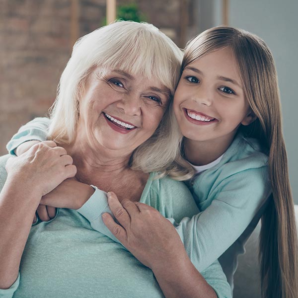 little girl hugging grandma